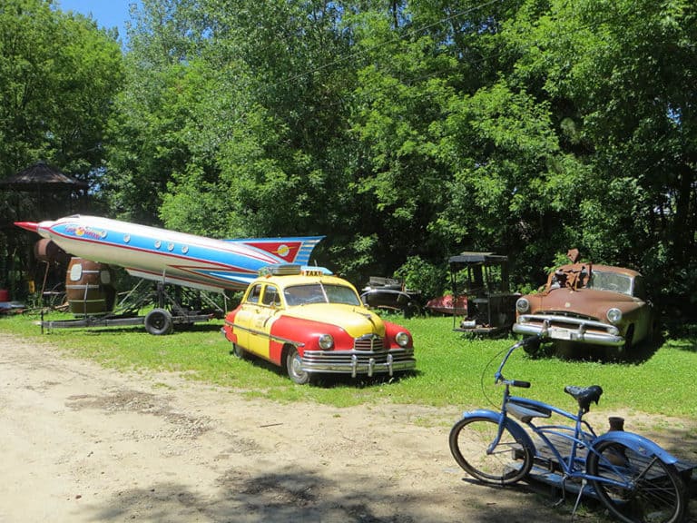 Rocket ship and old Cars